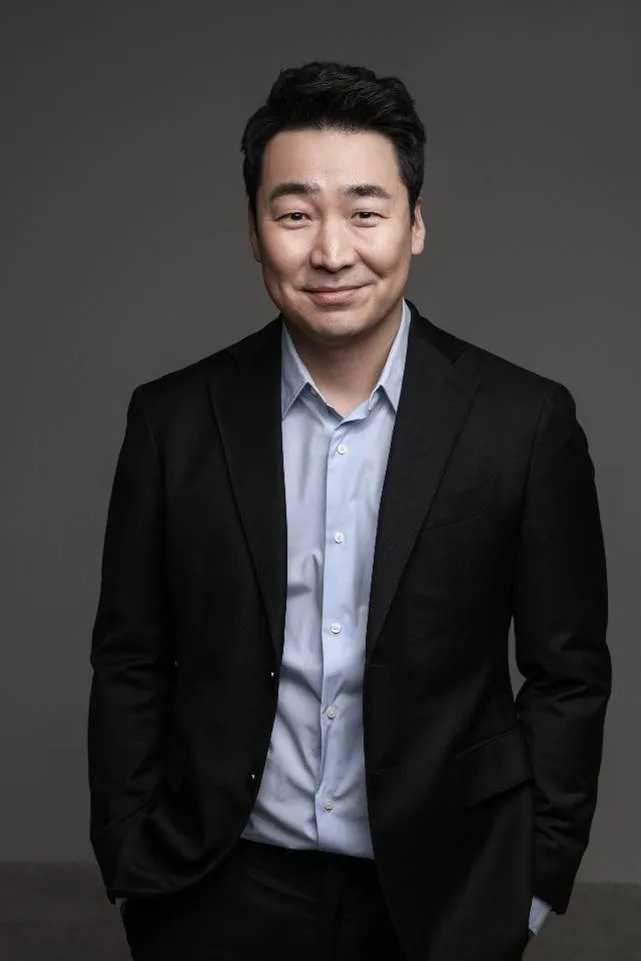 Portrait photograph of actor Kim Yong-Jae