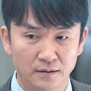 Kim Jong-Tae as police captain