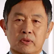 Takashi Naito portraying Junichi Oiwa