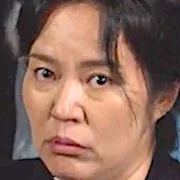 Kim Keum-Soon as Do Yong-Sik's landlord