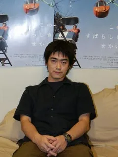 Portrait photograph of Japanese director and screenwriter Shuichi Okita.