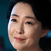 Yoshiko Tokoshima portrays Aiko Kuwanoki